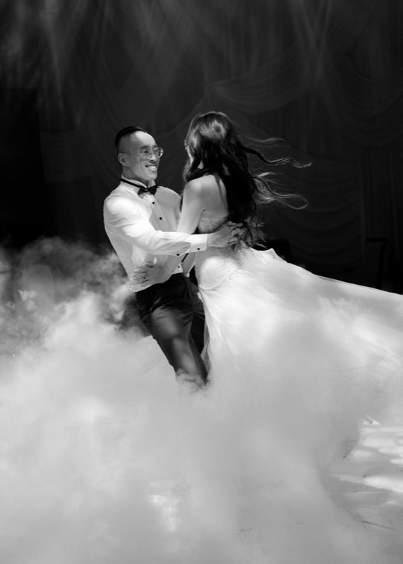 The studio photographing a bride on a balcony